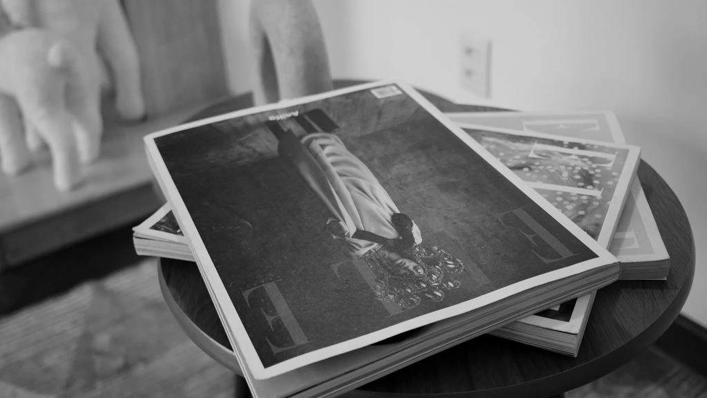 A stack of quarterly benchmark reports on a desk